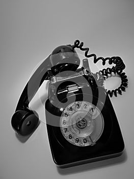 A vintage and antique telephone with white background. photo